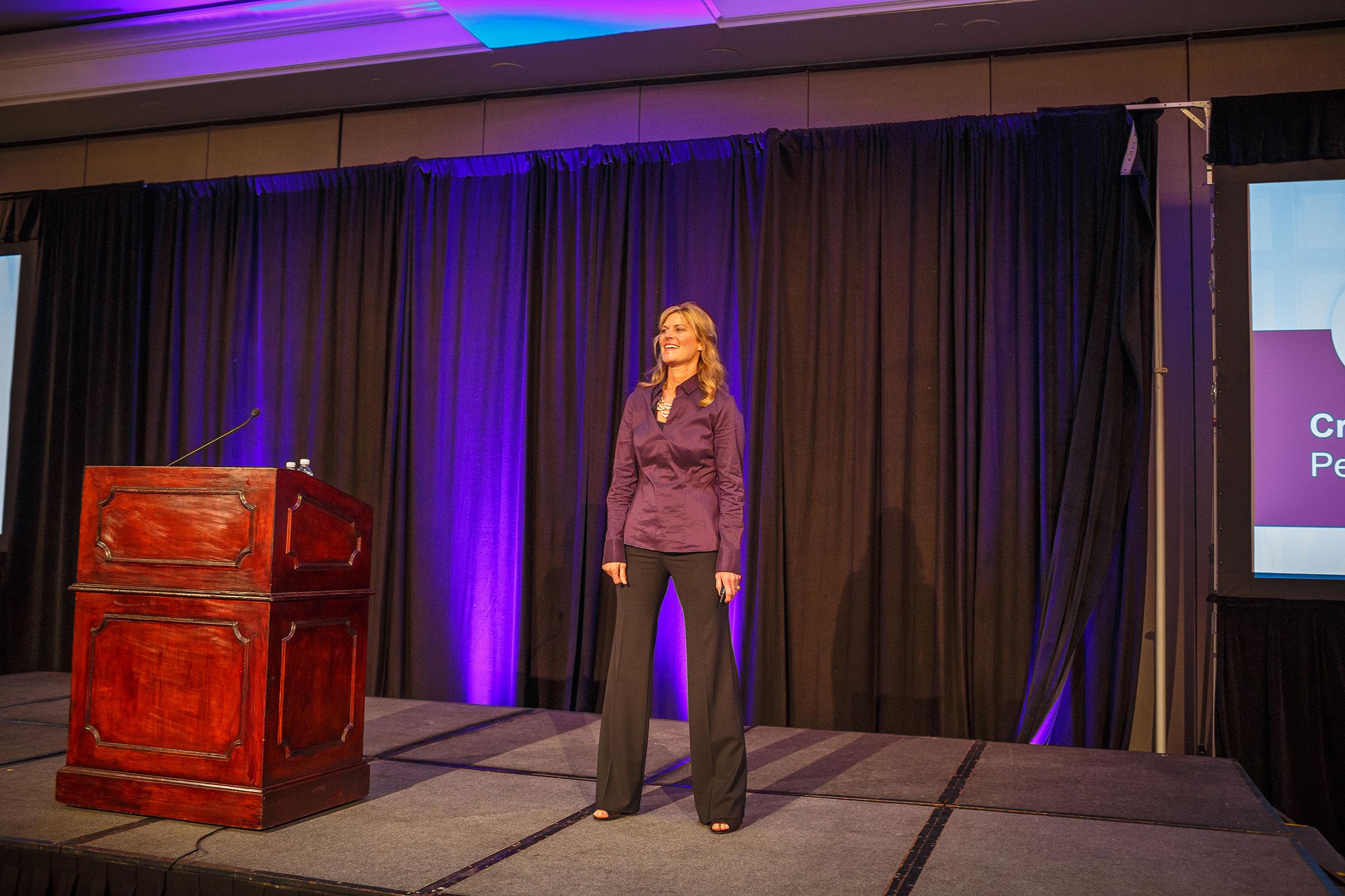 Coach Heidi Mount speaking at a dental conference